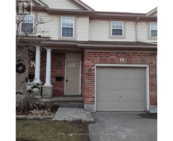 A house with the number 67 on the garage door.