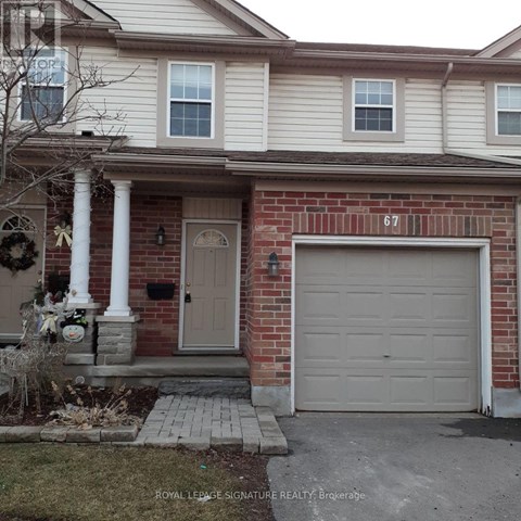 A house with the number 67 on the garage door.