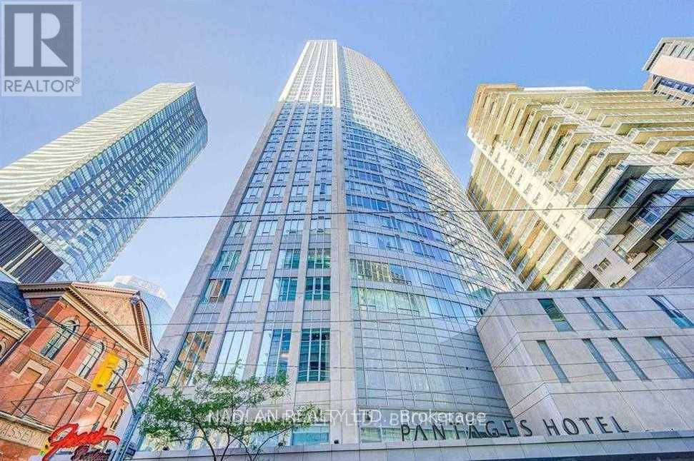 A tall building with the words Painted Pages Hotel on it.