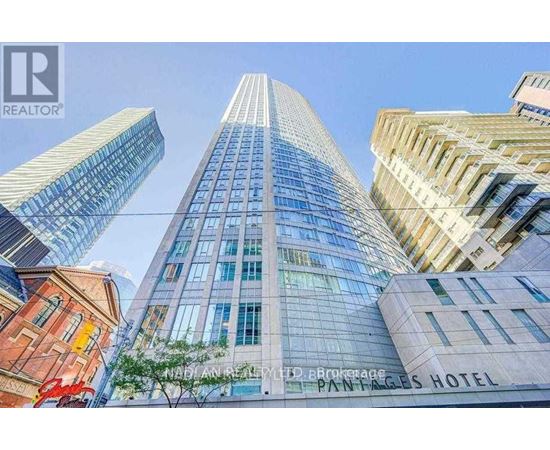 A tall building with the words Painted Pages Hotel on it.