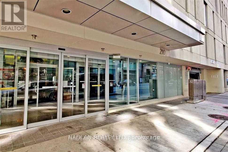 A realtor office is located in a building with the number 210 on it.