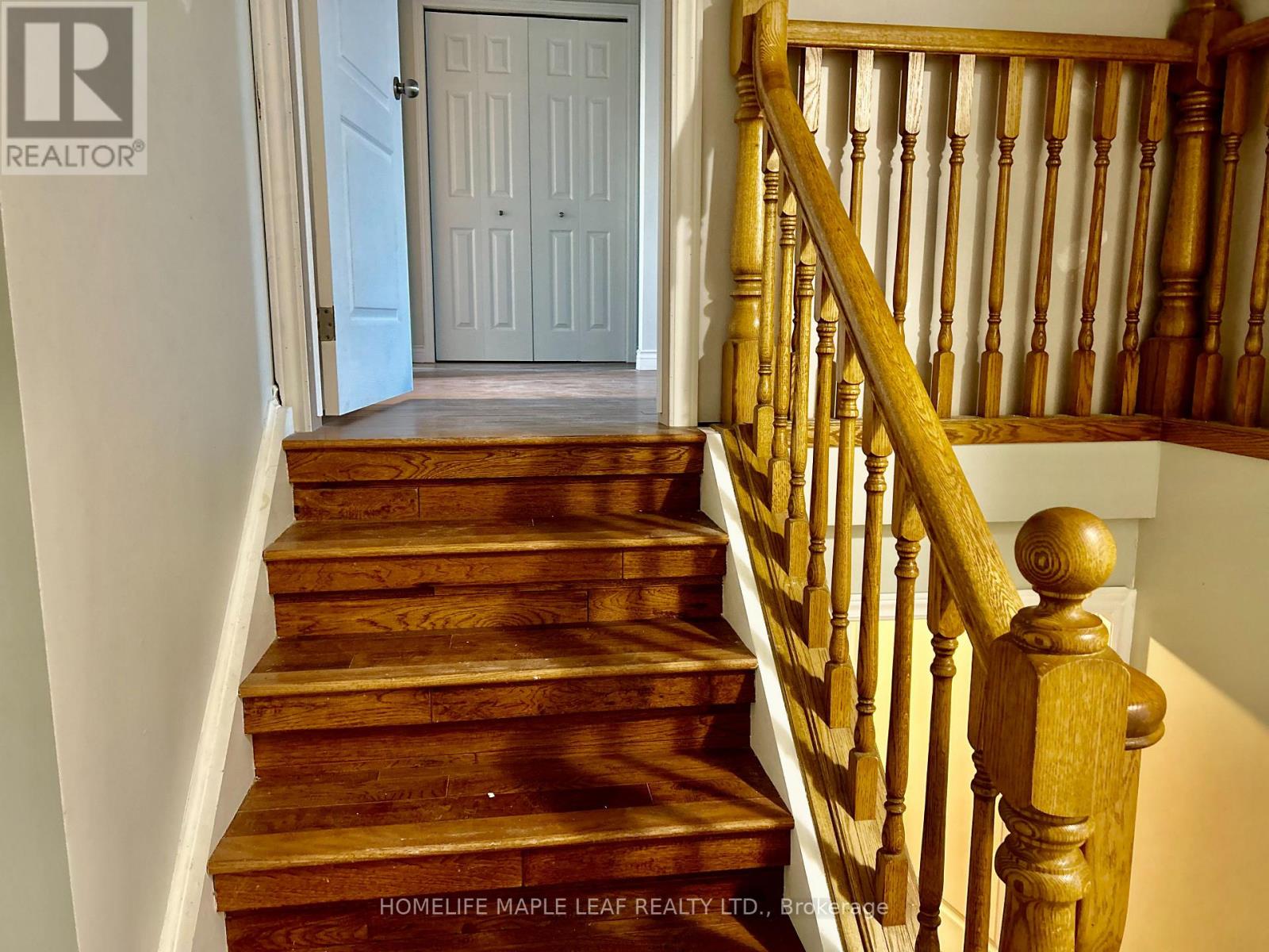 A staircase with wooden steps and a balustrade.