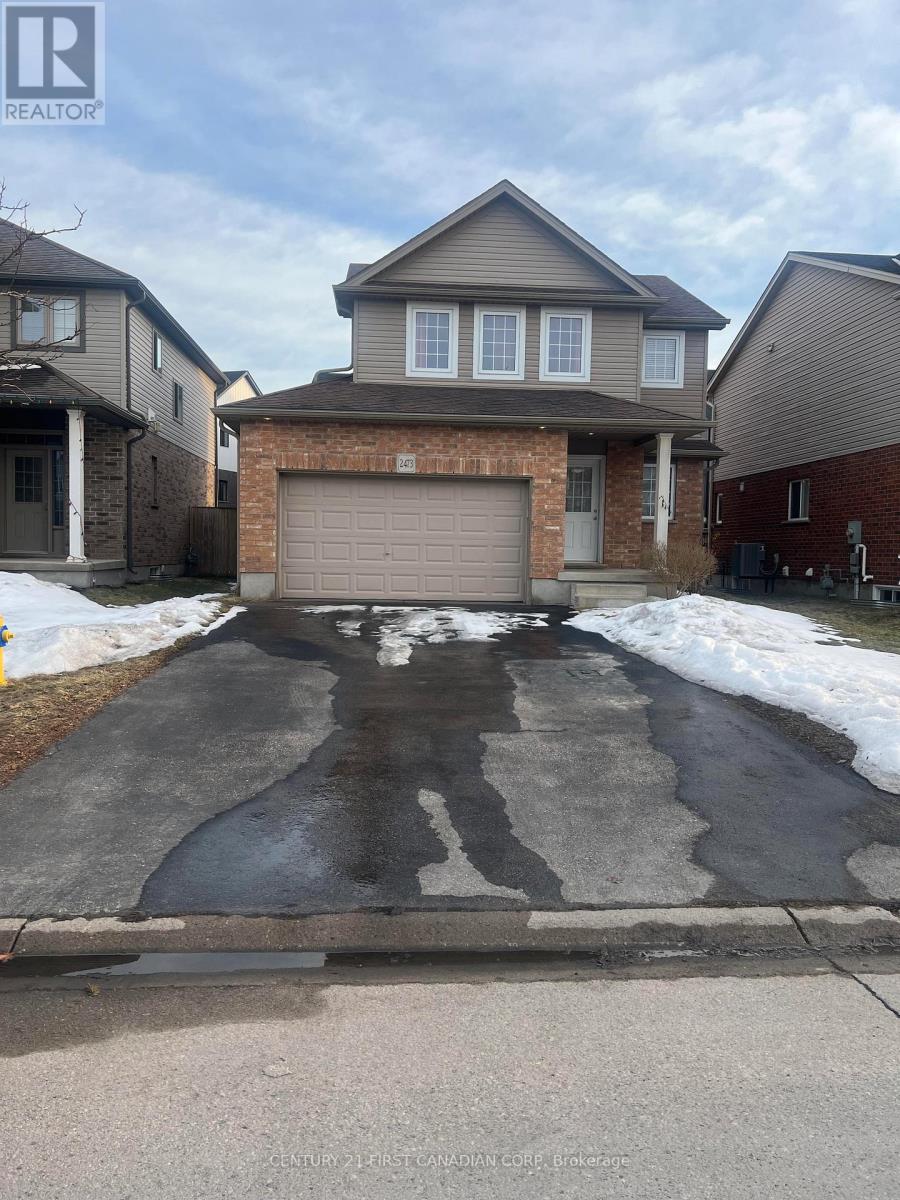 A house with a garage in front of it.