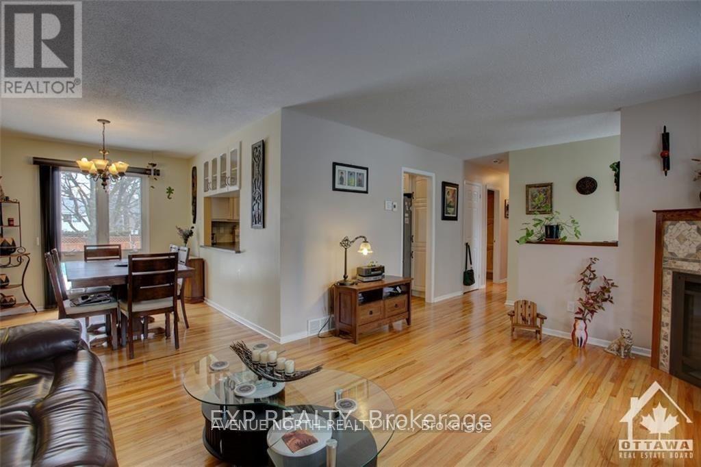 A living room with a couch, chairs, and a coffee table.