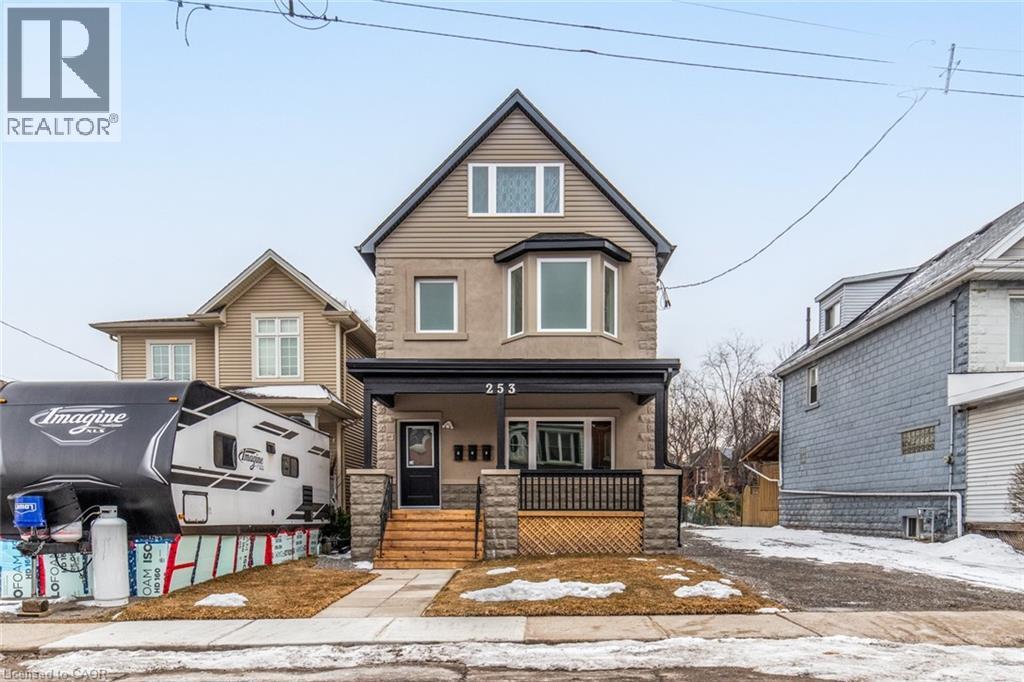 A house with a realtor logo in the corner.