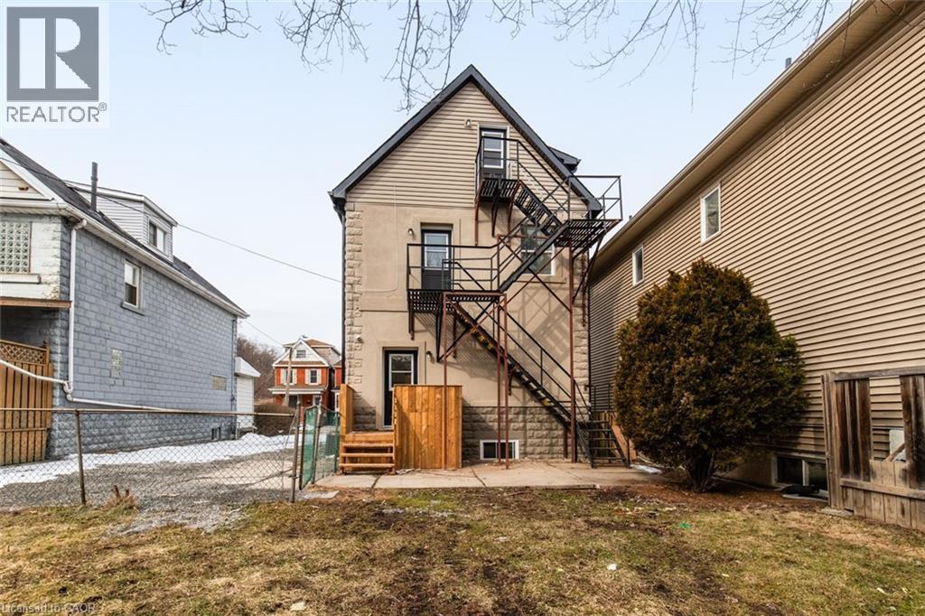 A house with a wooden exterior and a fire escape.