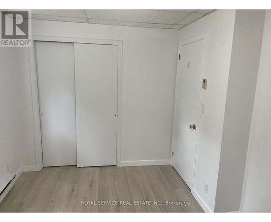 A white door is on the left and a white door with a handle is on the right.