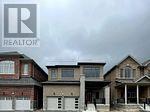 A realtor logo is on a picture of a house.