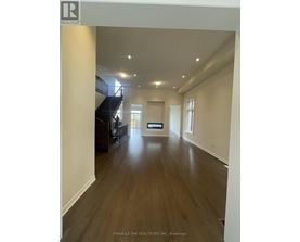 A realtor logo is on a picture of a house.