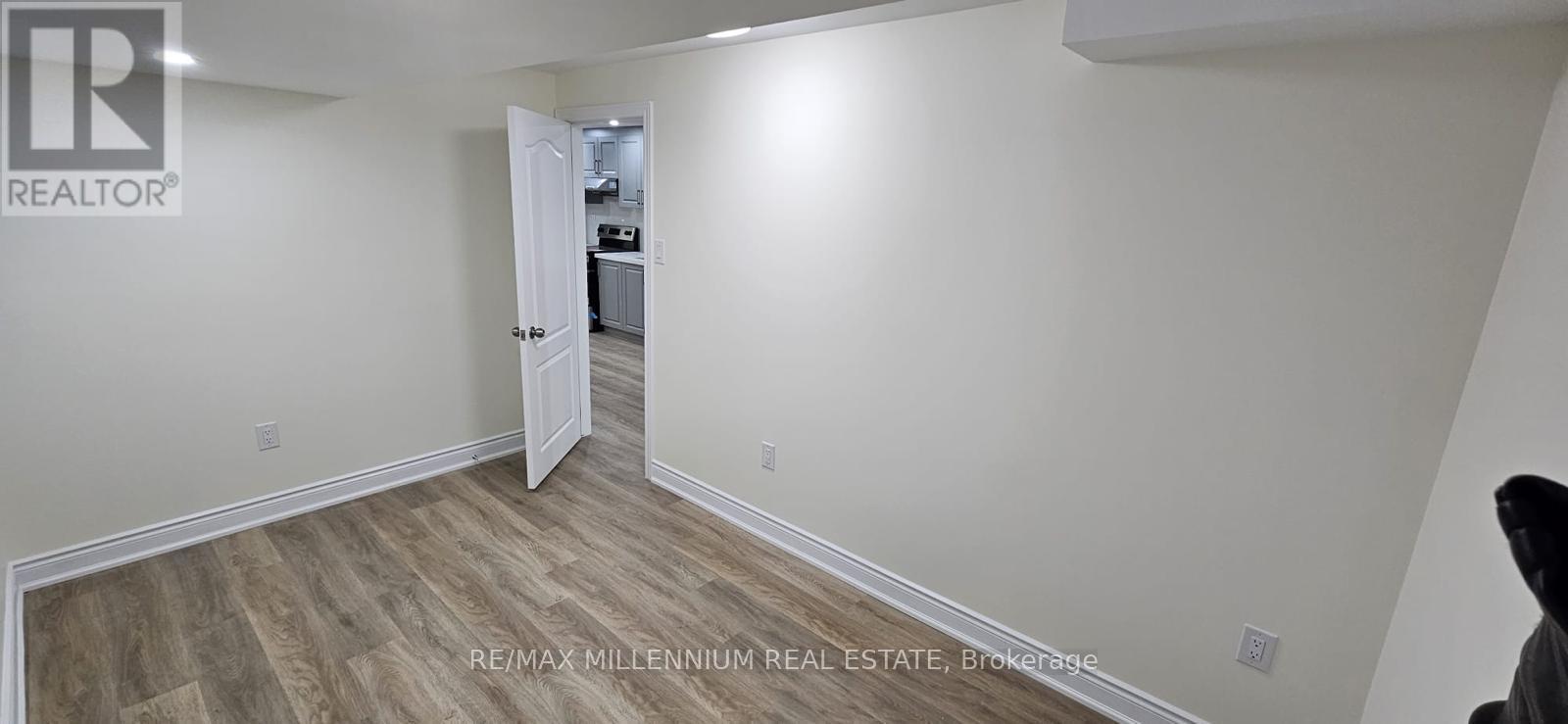 A room with a doorway leading to another room.
