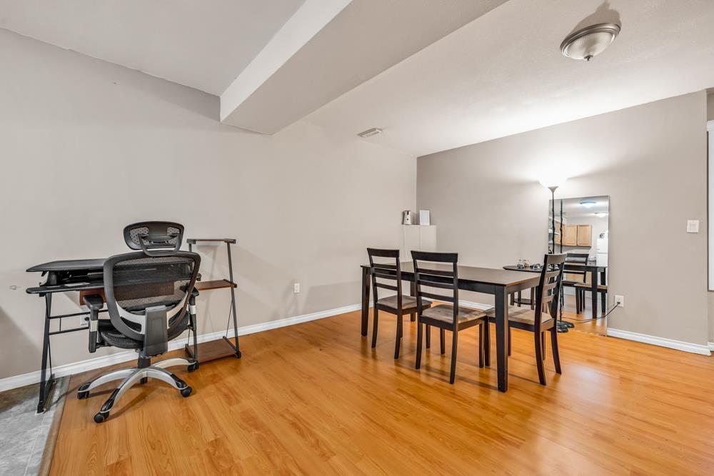 A room with a table and chairs.