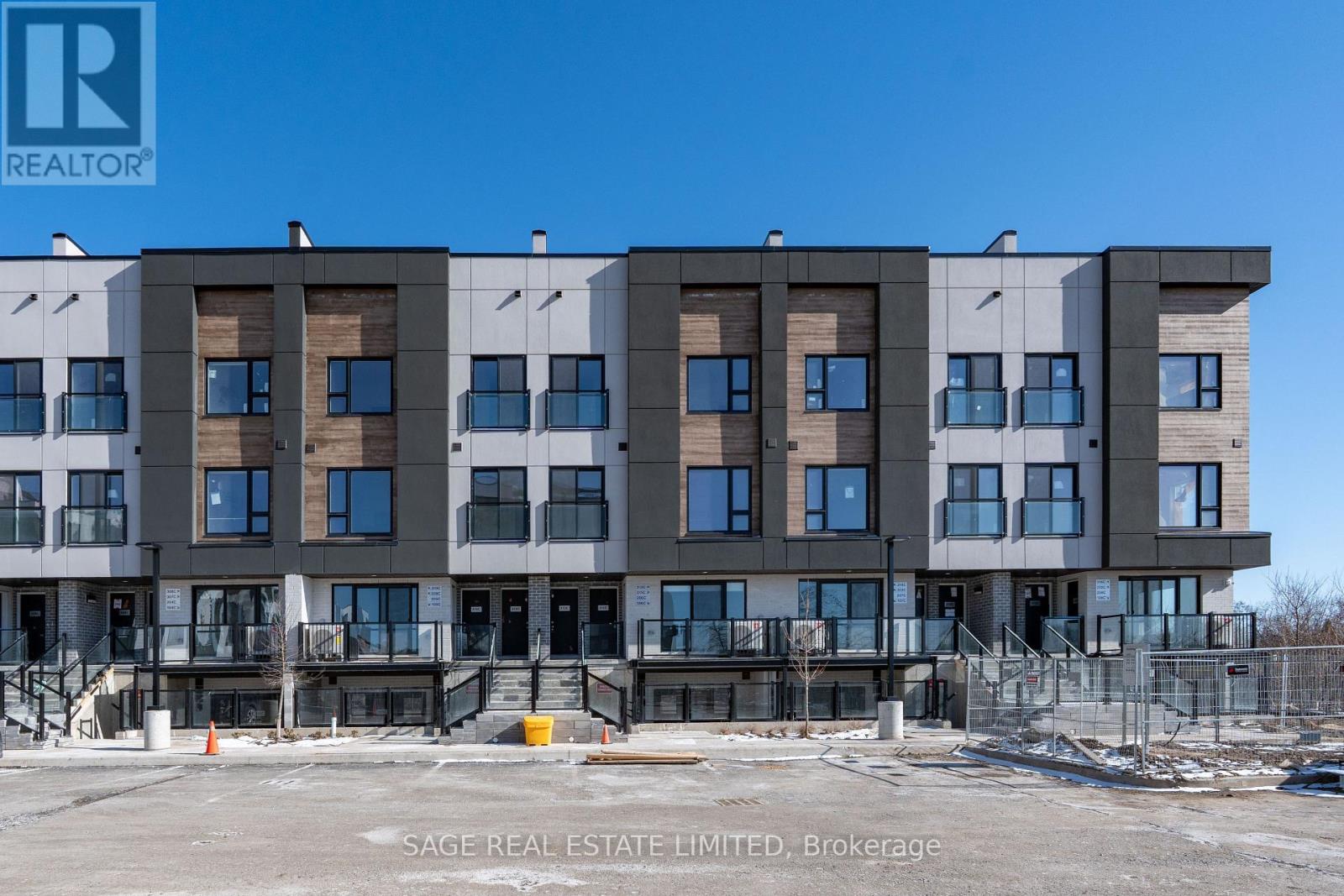 A multi-story building under construction with a clear blue sky in the background.