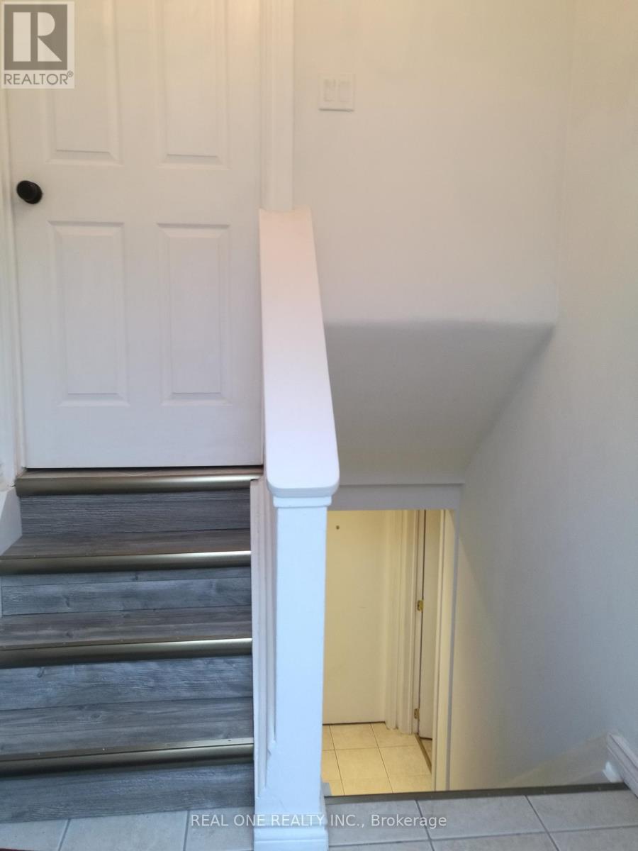 A white door is on the left and a white wall is on the right.