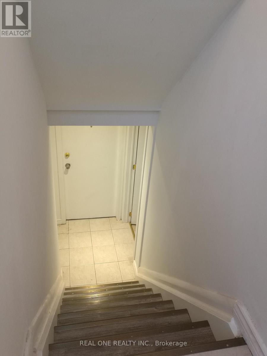 A staircase leading to a white door.