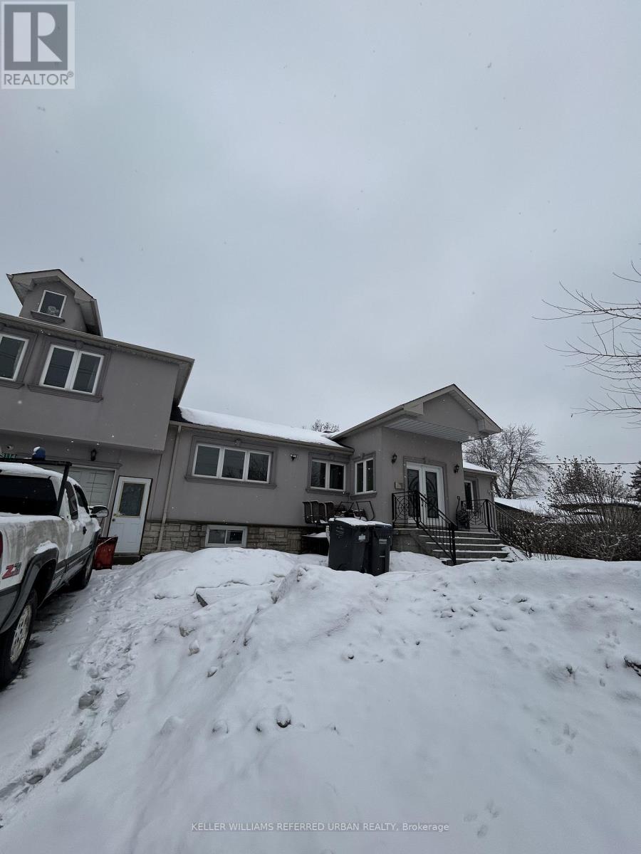 A house with a truck parked in front of it.