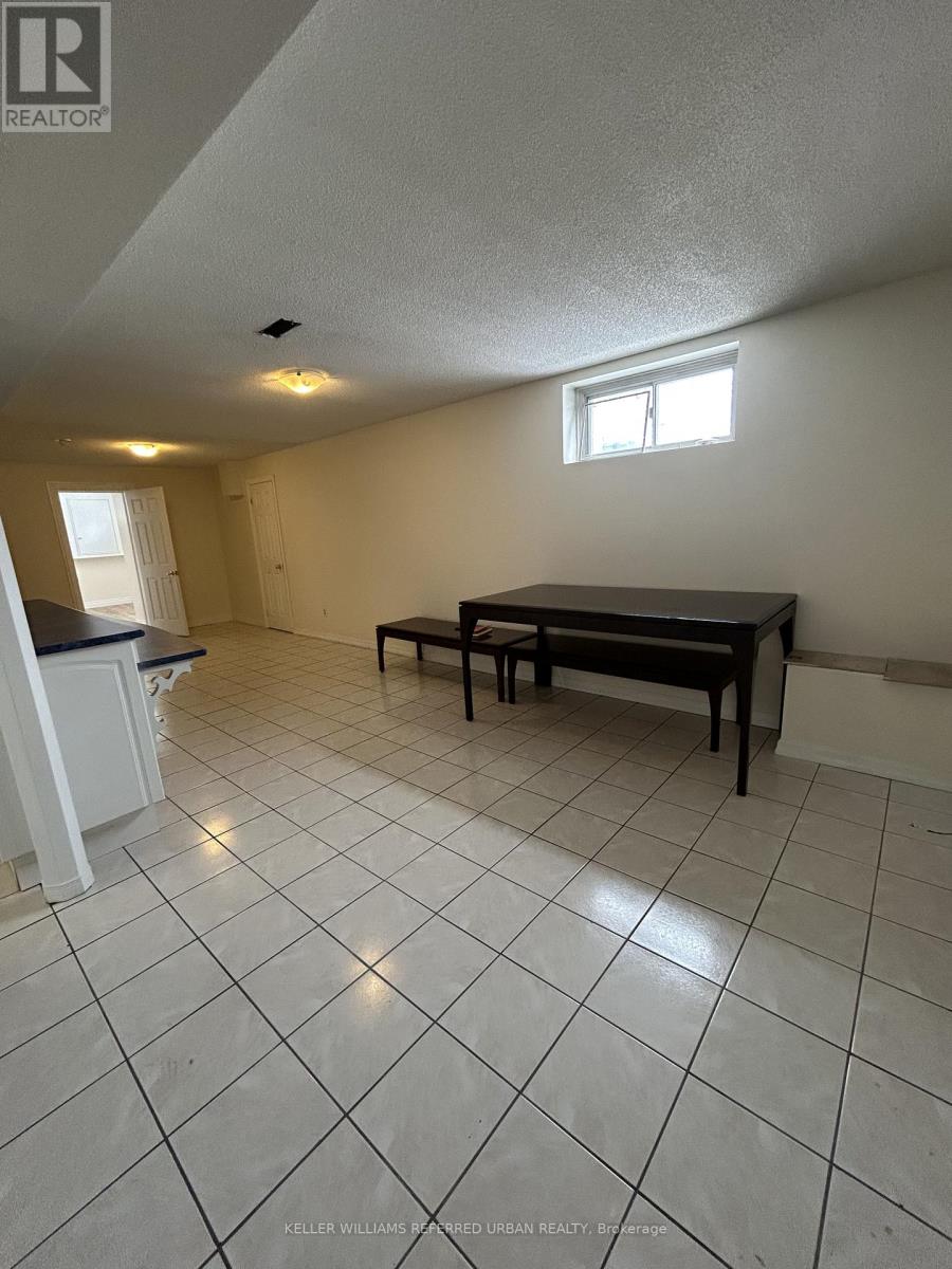 A room with a table and chairs in it.