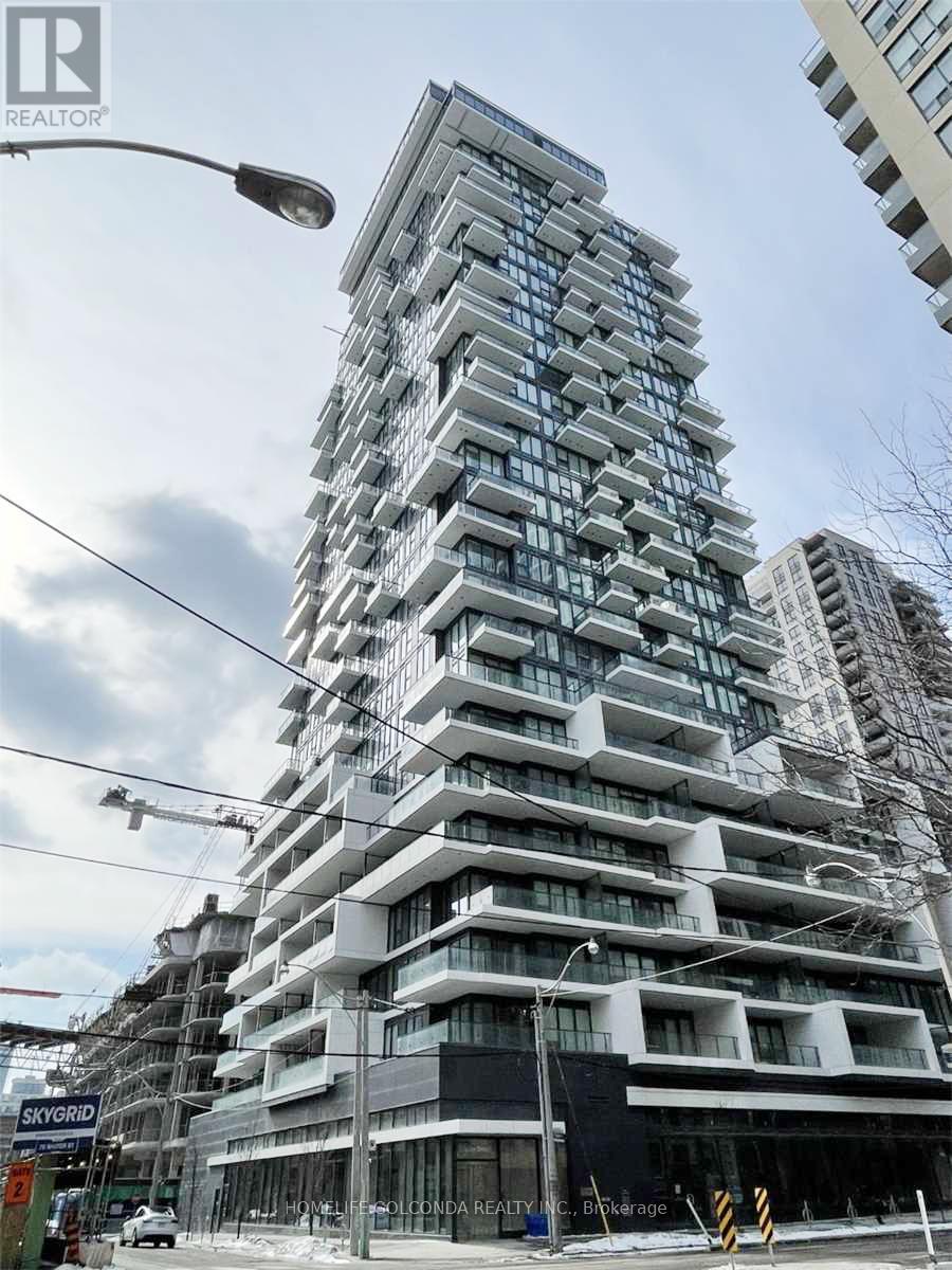 A tall building under construction with the words "SKYGRID" on the side.