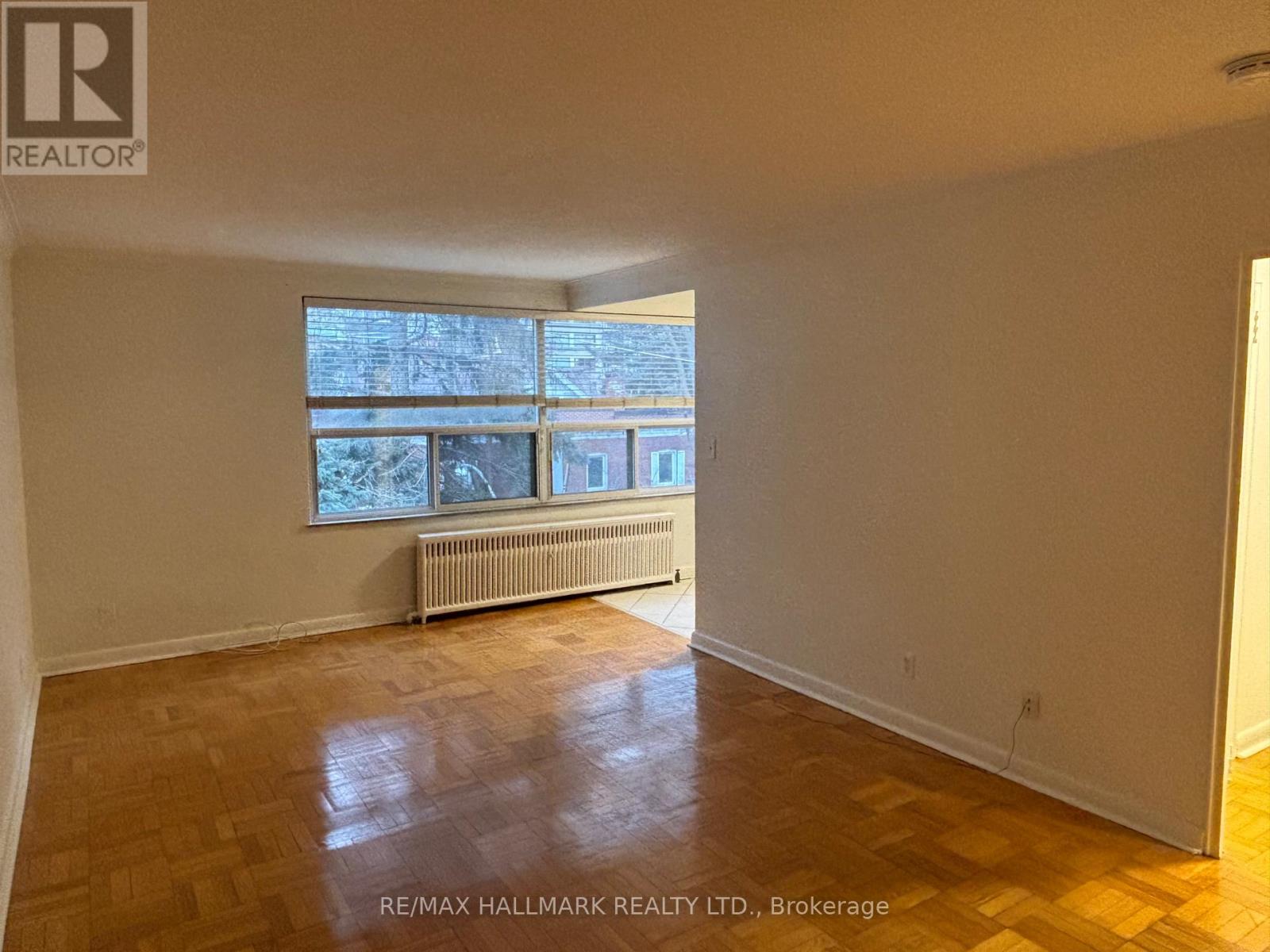 A room with a window and a radiator.