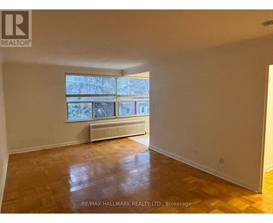 A room with a window and a radiator.