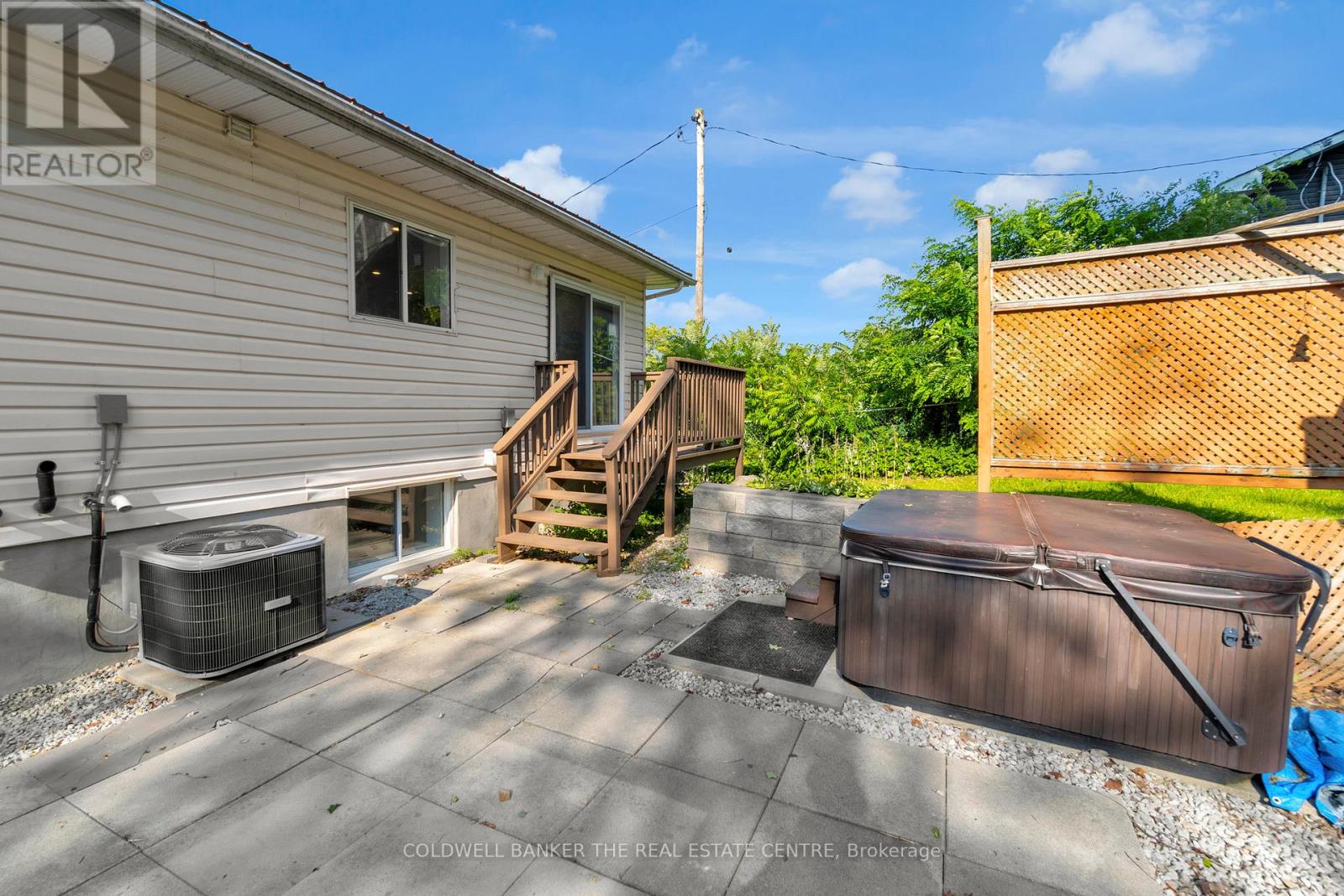A house with a hot tub in the backyard.