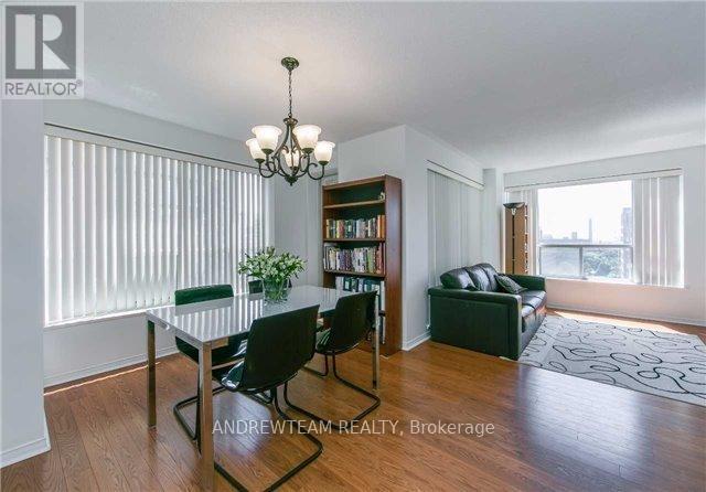 A dining room with a table and chairs is shown.