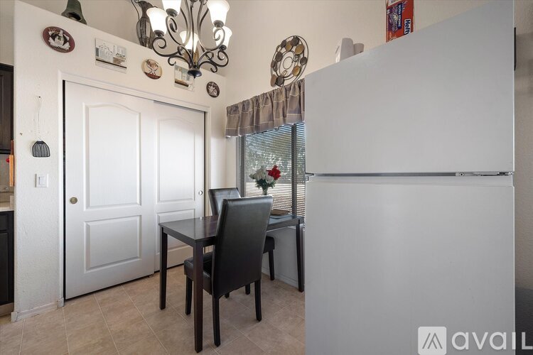 A dining area with a table and chairs is visible.