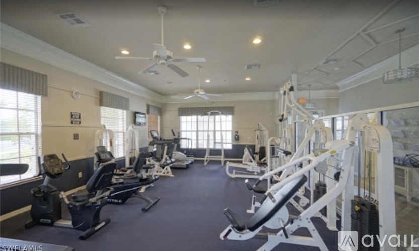 A spacious gym with a variety of exercise equipment.
