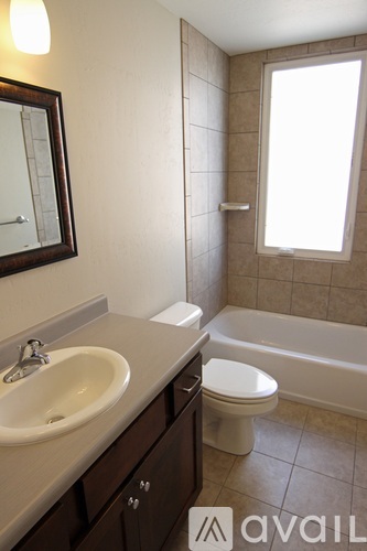 A bathroom with a sink, toilet and bathtub.