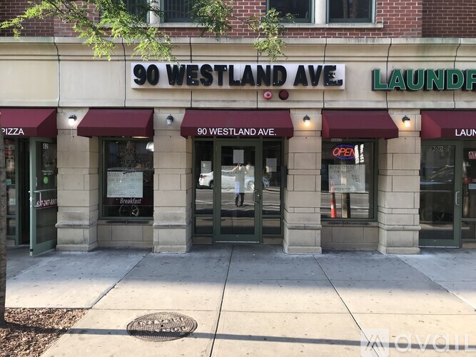 A building with a sign that says 90 Westland Ave.