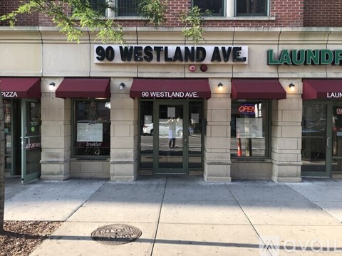 A building with a sign that says 90 Westland Ave.
