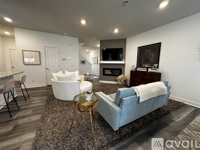 A living room with a blue couch and a coffee table.