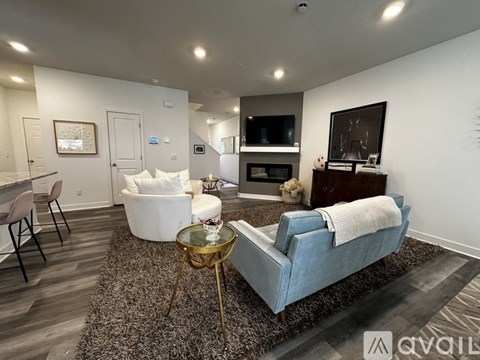 A living room with a blue couch and a coffee table.