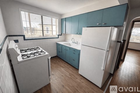 A kitchen with a white refrigerator and a white stove top oven.
