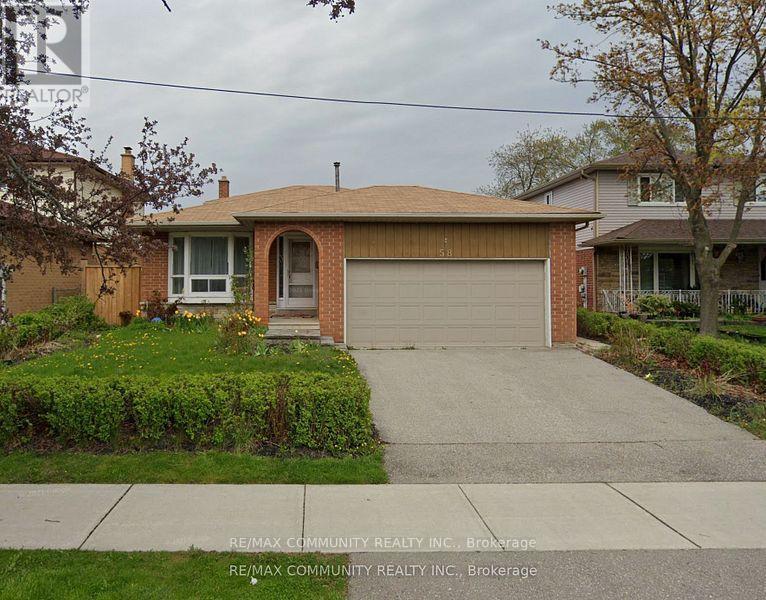 A house with a garage is for sale.