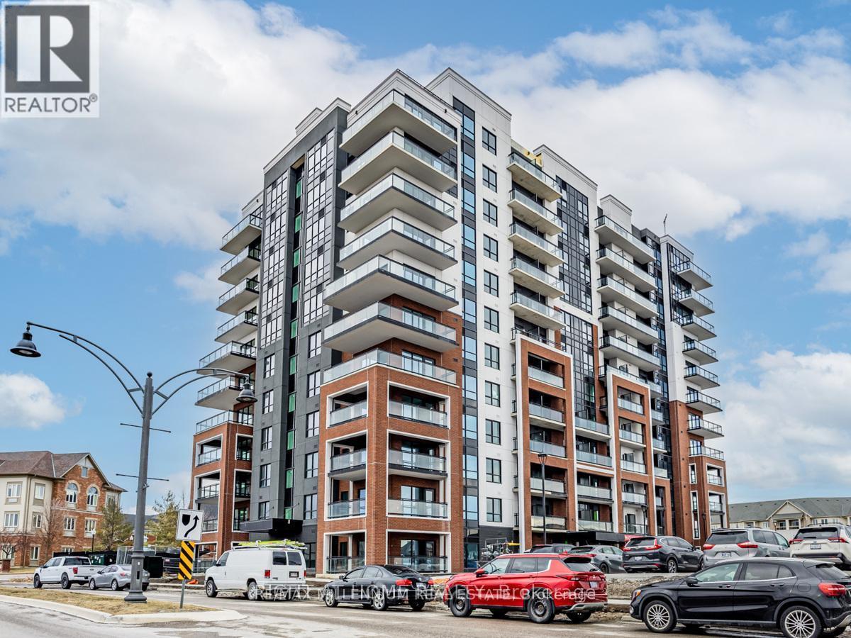 A modern apartment building with cars parked in front.