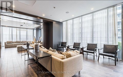 A modern living room with a large sectional sofa and a coffee table.