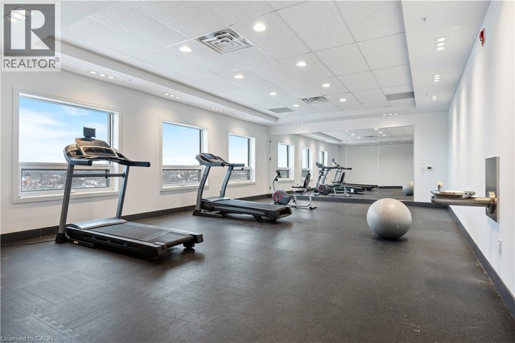 A gym with treadmills, exercise balls, and weights.