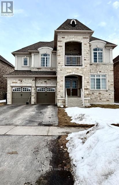 A large house with a driveway in front of it.