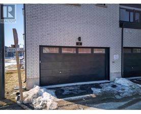 A garage door of a building with a sign that says "REALTOR" on it.