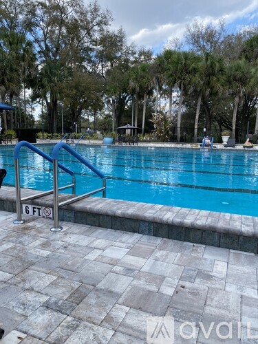 A pool with a blue ladder and a sign that says 6 ft.