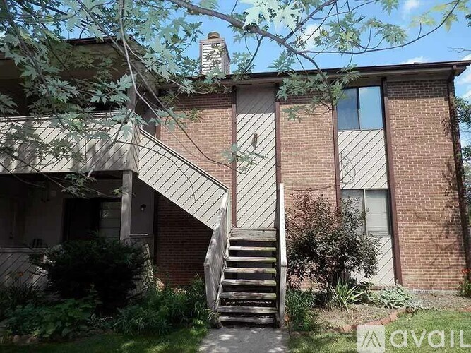A house with a staircase leading to the second floor.