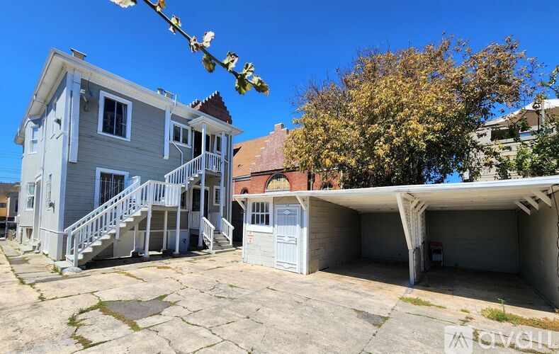 A two-story house with a garage is for sale.