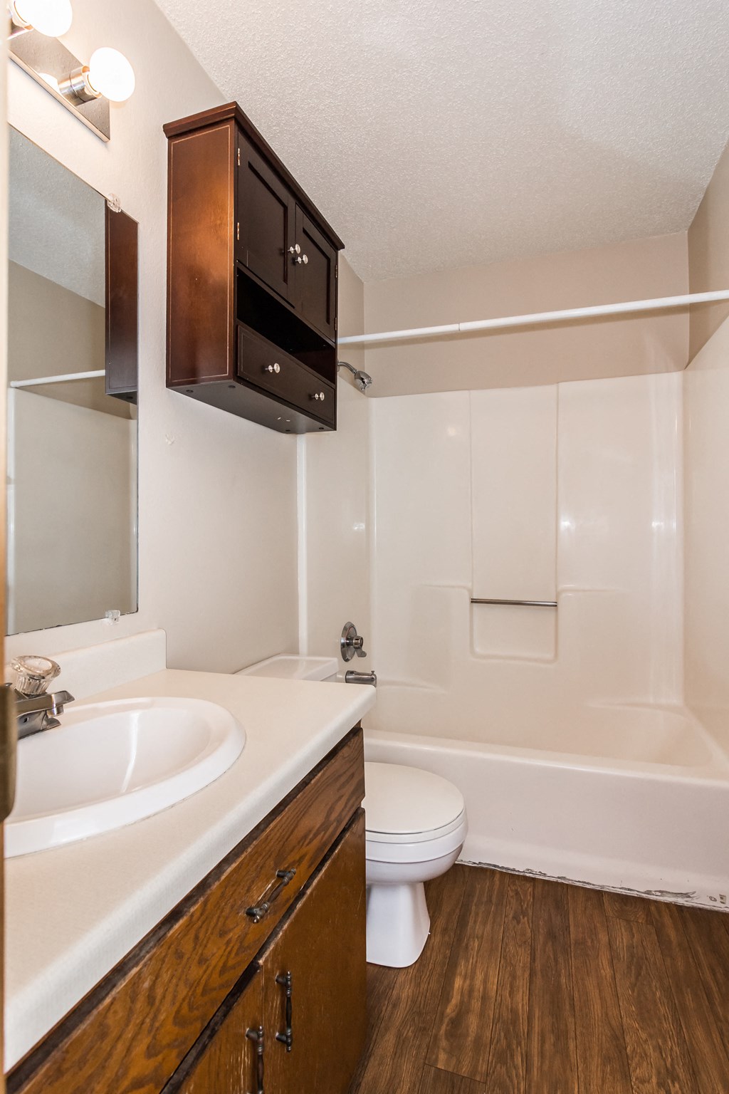 Grand Forks Kremer Apartments. A bathroom with a bathtub, toilet, and sink