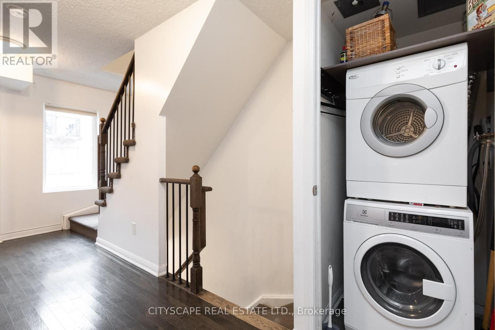 A white washing machine is in a laundry room.