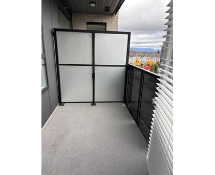 A glass door with a black frame is closed.