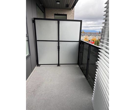 A glass door with a black frame is closed.