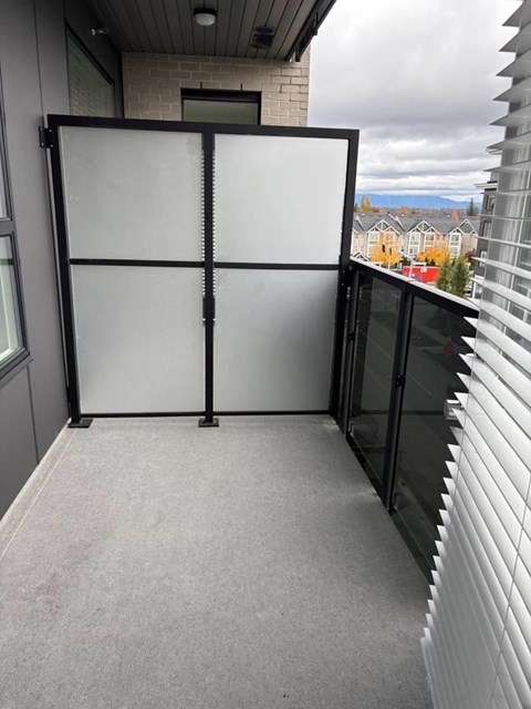 A glass door with a black frame is closed.