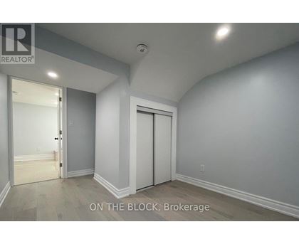 A room with a door and a window.