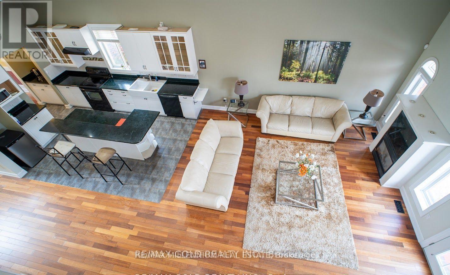 A living room with a white couch and a coffee table.