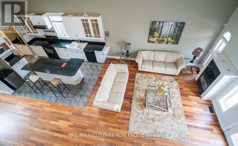 A living room with a white couch and a coffee table.